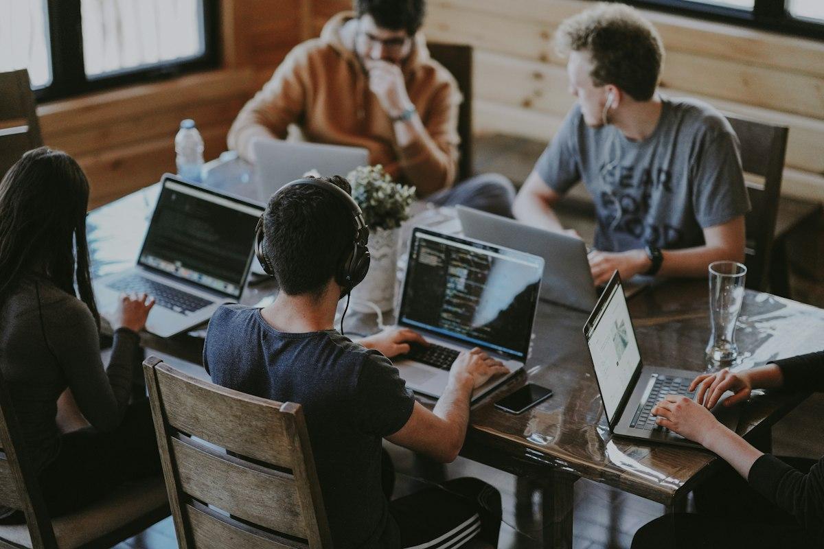 People collaborating at a laptop